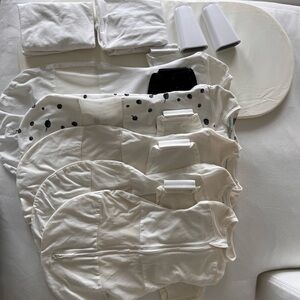 Lot of Snoo sleep sacks, mattress, sheets and leg lifters.